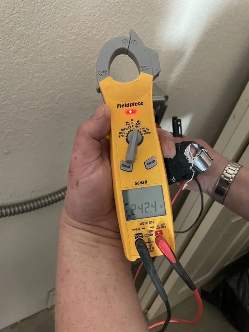 Voltage testing with clamp meter during Electrical Installation Services in Bushnell